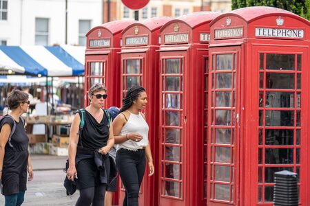 Cambridge, UK, August 1, 2019. Tourists walking down at the street of Cambridge on a busy sunny day...