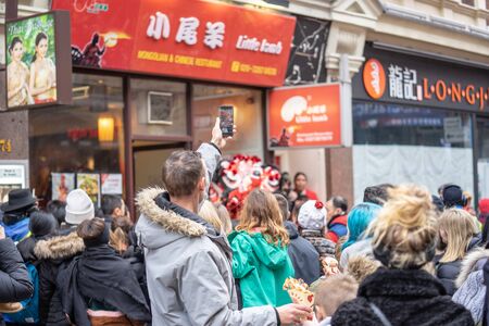 London, January 26, 2020. Spectators taking pictures with cell phones during Chinese New Year...