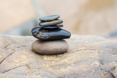 A small pile of pebbles on the beach at summer dayの写真素材