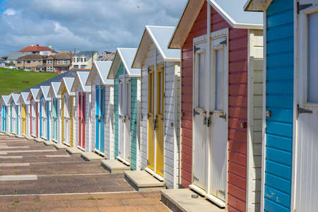 Multi coloured beach huts facing the beach at Bude, Cornwall UK July 6 2020のeditorial素材