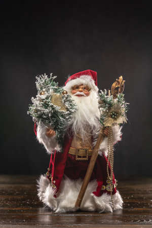 Santa Claus doll toy standing on a wooden tableの写真素材