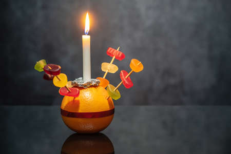 Orange Christingle is a symbolic object used in the Advent, Christmas and Epiphany services of many Christian denominationsの写真素材