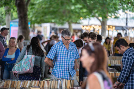 Nestled under Waterloo Bridge is one of the only permanent outdoor second hand book markets in the south of England. UK, London, August 15, 2021のeditorial素材