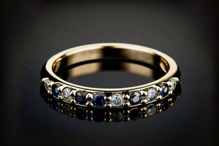 Gold round cut blue sapphire and diamond half eternity ring on black background created with generative AI technology. High quality illustrationの写真素材