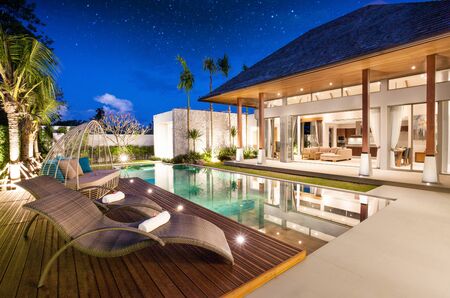 exterior and interior design of pool villa which features living area, greenery garden