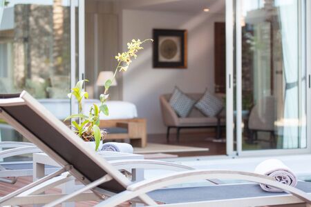 Luxury Interior design in bedroom of pool villa with cozy king bed. Bedroom with high raised ceilingの写真素材