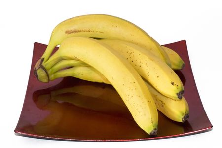 Dish with five yellow bananas for eating healthyの写真素材