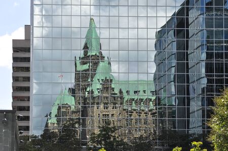 Ottawa Parliament reflected in a skyscraperのeditorial素材