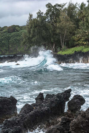 Waves crashing into rocks, Maui, Hawaiiの写真素材