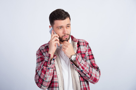The guy in a shirt talk on the phoneの写真素材