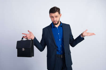 Young businessman with a leather briefcaseの写真素材