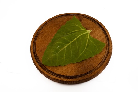 sorrel leaf on a wooden matの写真素材
