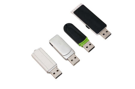 four USB memory sticks on a white background