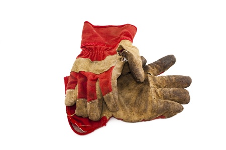 old work gloves isolated on white backgroundの写真素材
