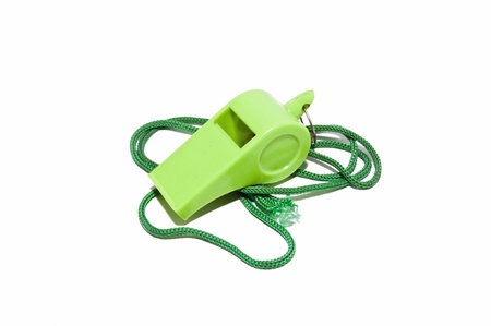 whistle in green isolated on white backgroundの写真素材