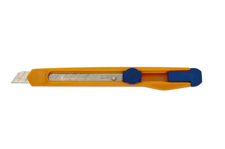 old office knife isolated on a white backgroundの写真素材