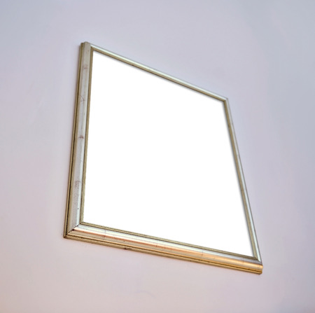 Blank picture frame on white wallの写真素材
