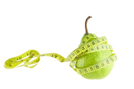 Ripe green pear with measuring tapeの写真素材