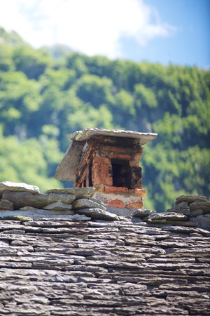Gray roof with chimney of a small townの写真素材