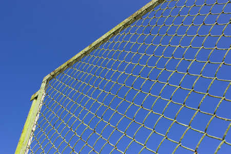 Fence on a blue sky backgroundの写真素材