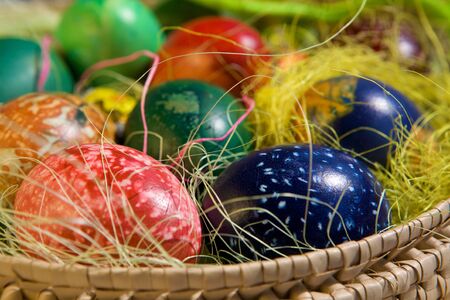 Coloring Easter eggs in basket