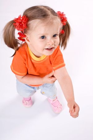 Child girl in orange t-shirt. Angle white background.の写真素材