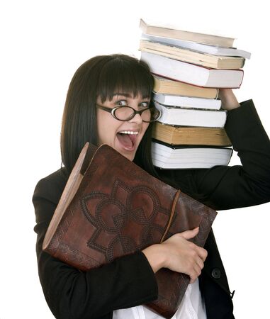 Clever girl with heap book. Isolated.の写真素材