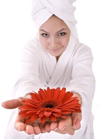 Girl with red flower and white towel on head .Isolated.の写真素材