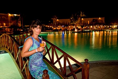 Beautiful girl drink cocktail in  night city.の写真素材