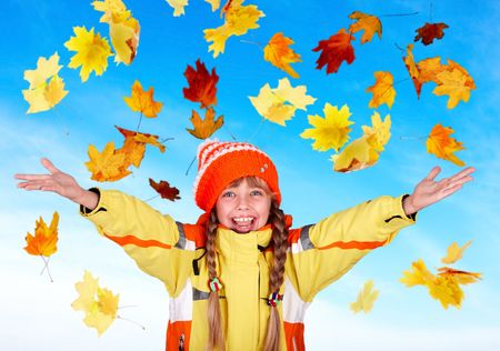 Girl child in autumn orange hat with outstretched arm. Outdoor.の写真素材