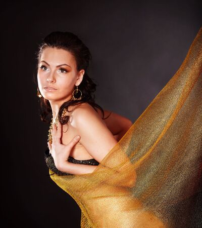 Beautiful young woman on grey background.の写真素材