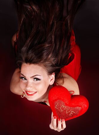 Girl with heart  in red flying.Valentines day.の写真素材