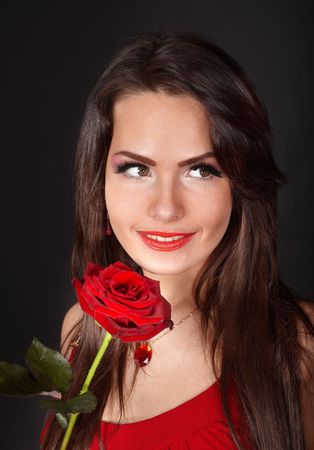 Girl with flower rose on grey background. Valentines day.の写真素材