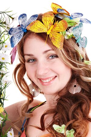 Girl with butterfly and flower on head. Spring hair. Isolated.の写真素材