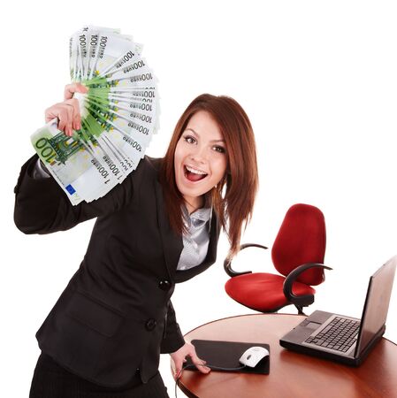 Businesswoman with group of money and laptop. Isolated.の写真素材