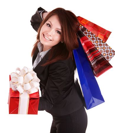 Girl in business suit with group gift box and bag. Isolated.の写真素材