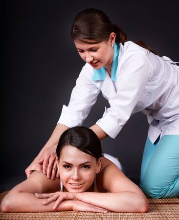 Beautiful white girl having thai massage. Beauty spa.の写真素材