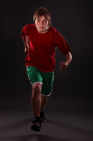 Man running on studio white isolated background.の写真素材