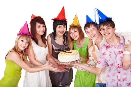 Group teenager in party hat with cake. Isolated.の写真素材