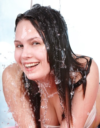 Beautiful girl with wet hair. Isolated.の写真素材