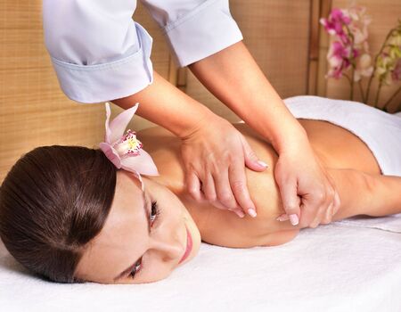 Young beautiful woman on massage table in beauty spa. Series.の写真素材