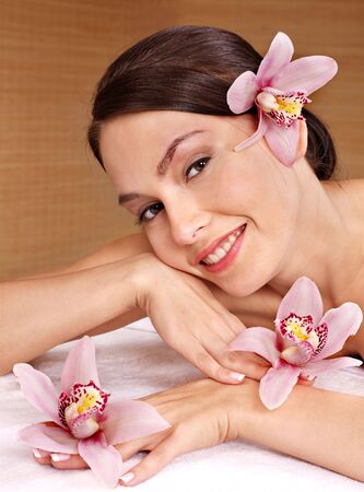 Young beautiful woman on massage table in beauty spa. Series.の写真素材