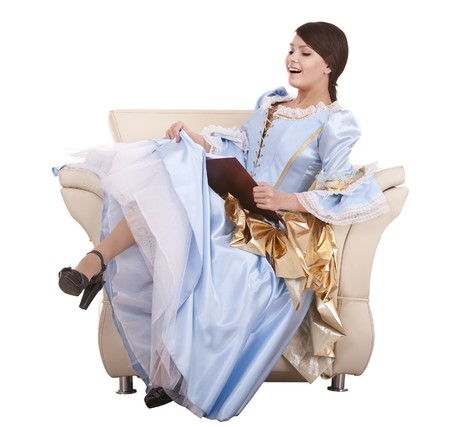 Young womanl reading book on chair.Isolated.の写真素材