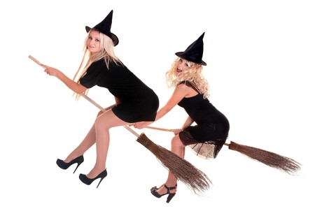 Group Halloween witch blond in black costume and hat fly on broom.Isolated.の写真素材