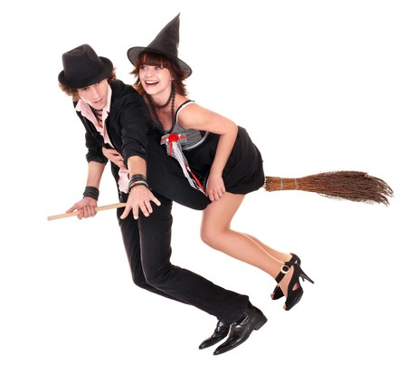 Group Halloween witch blond in black costume and hat fly on broom.Isolated.の写真素材
