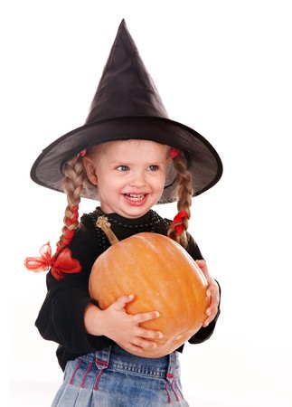 Child girl  Halloween witch  in black hat and dress with pumpkin, broom.Isolated.の写真素材