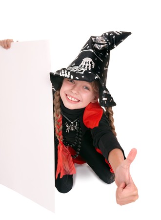 Child  witch holding banner and thumb up. Isolated.の写真素材