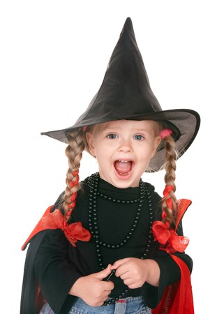 Little girl witch in black hat. Isolated.の写真素材