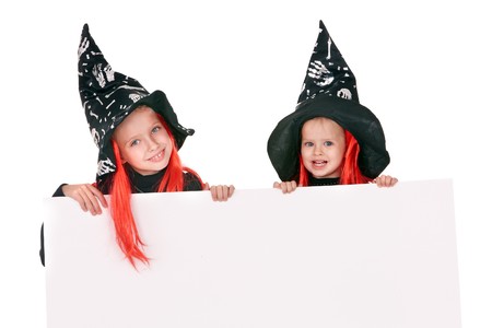 Child  witch holding banner and thumb up. Isolated.の写真素材