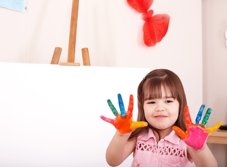 Little girl  making hand prints.の写真素材